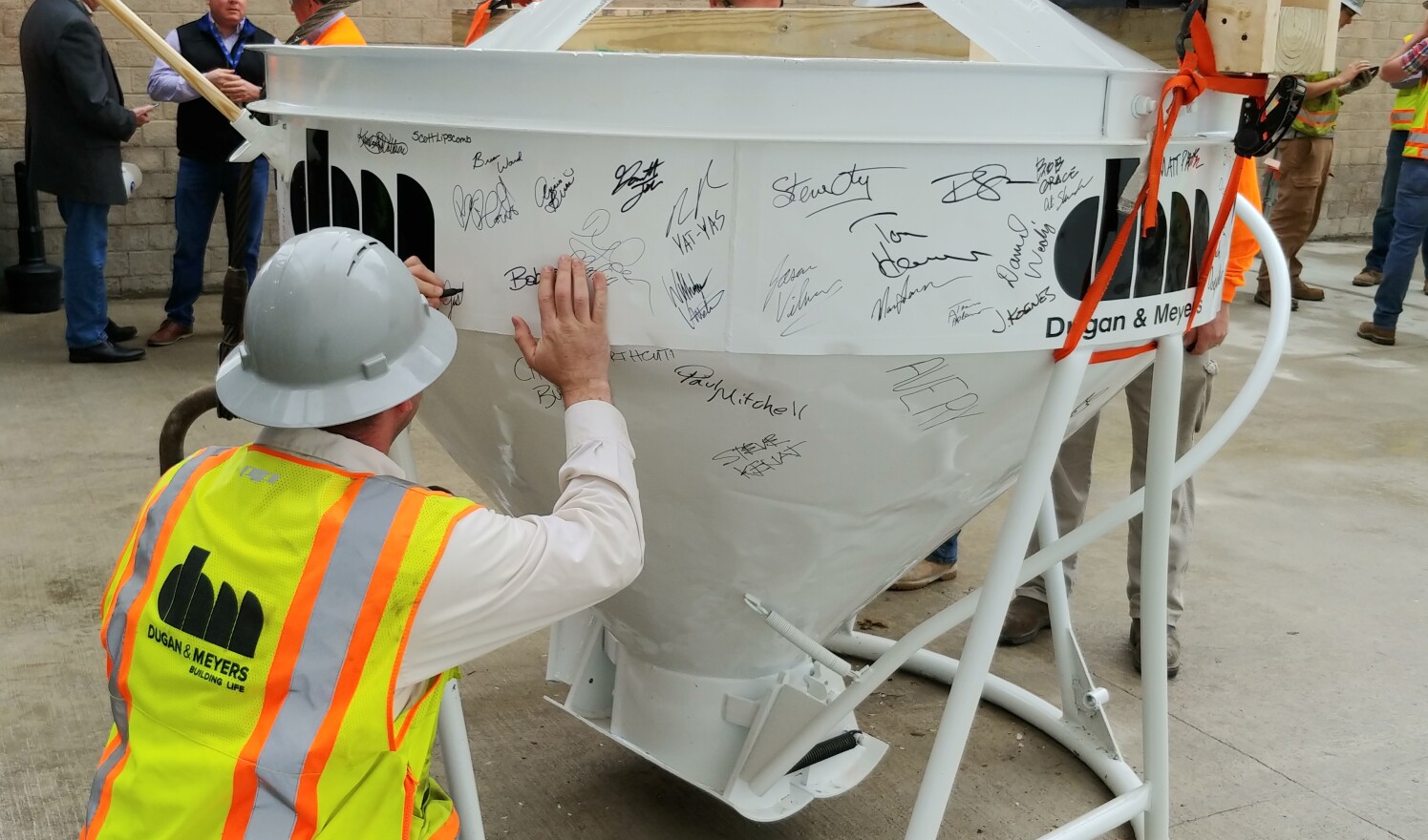 Workers signed the hopper before it was raised to the roof.